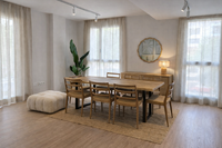 Mediterranean interior design dining room with wooden table and natural light in Mallorca