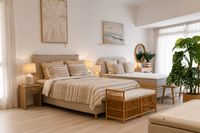 Mediterranean bedroom furniture with natural textiles, bedside tables, benches and soft neutral styling in a relaxed Mallorca sh