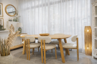 Mediterranean dining room with natural wood furniture and soft light in Mallorca